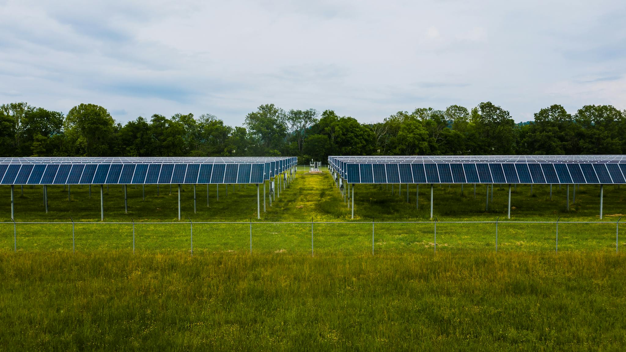 Photo by Kelly Modern photovoltaic solar energy station in lush countryside